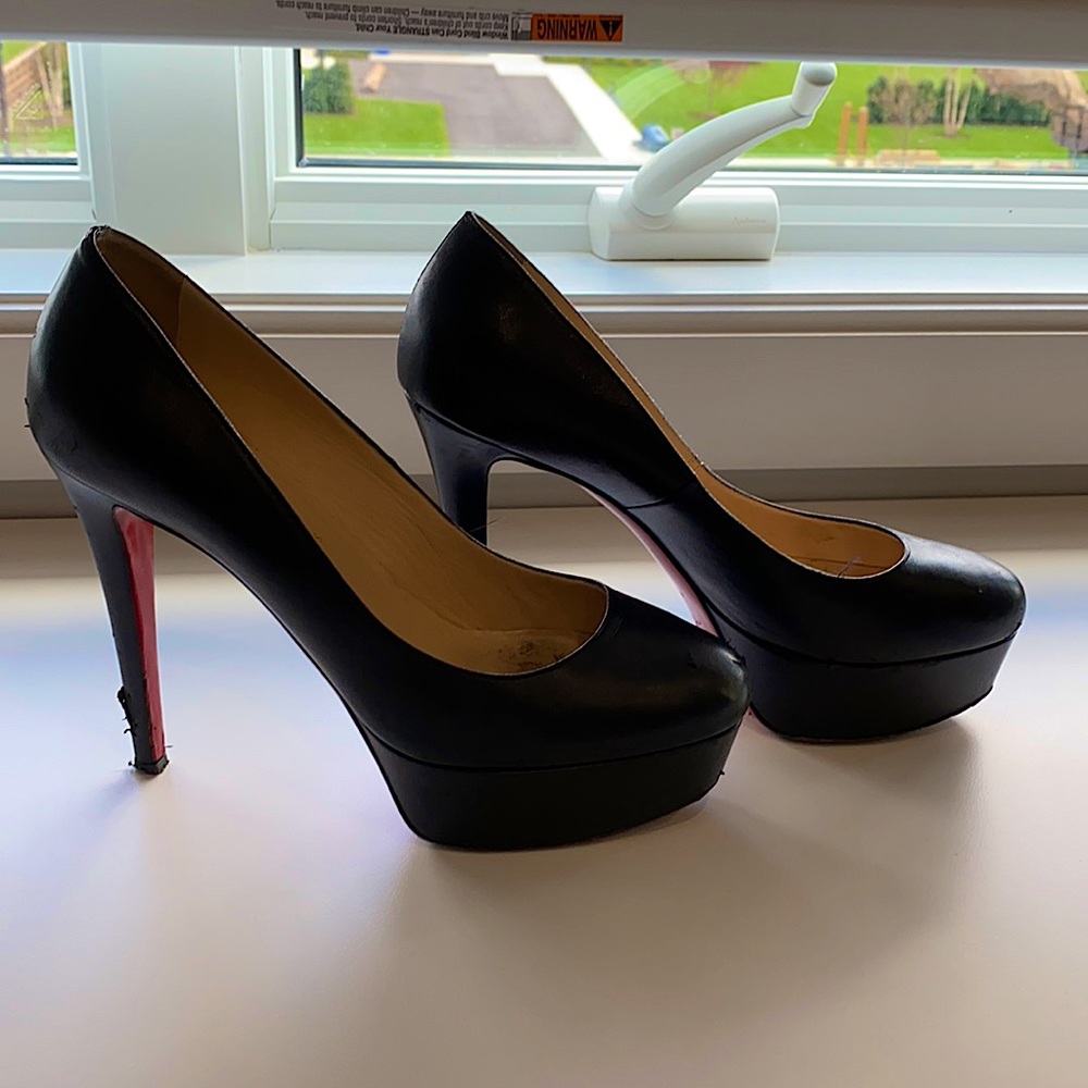 Christian louboutin black heels with platform.